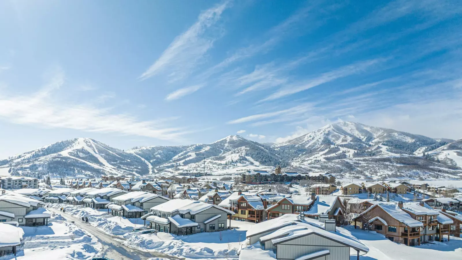 Snow-covered vacation homes below the ski runs of Park City, Utah